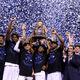 The Duke Blue Devils celebrate with the championship trophy after defeating the Wisconsin Badgers 68 to 63 during the NCAA Men's Final Four National Championship at Lucas Oil Stadium on April 6, 2015, in Indianapolis. (Streeter Lecka/Getty Images)